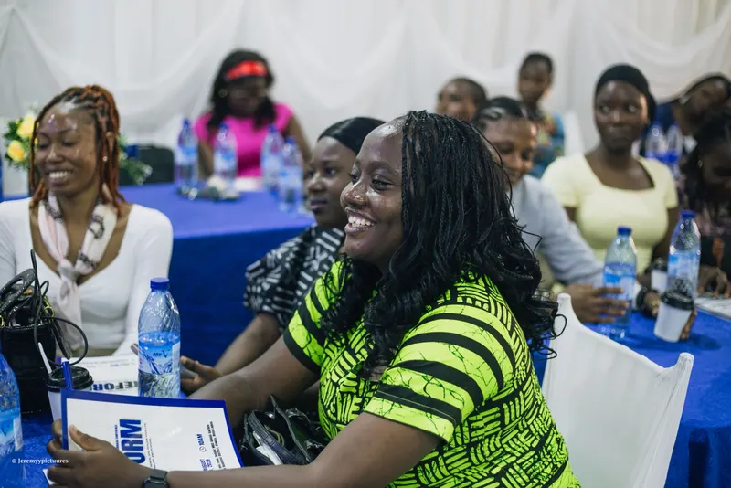 Guests smiling as they listen at the Reform conference
